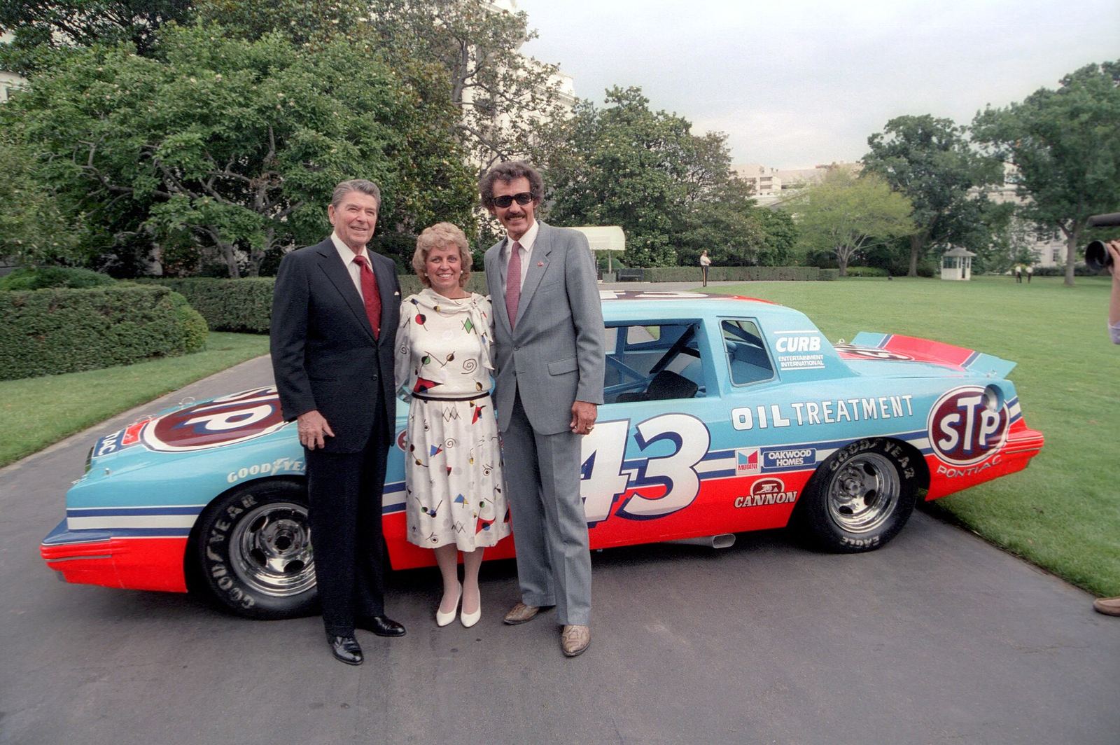 President Ronald Reagan with Richard and Lynda Petty in front of the No. 43 STP Pontiac on the White House lawn